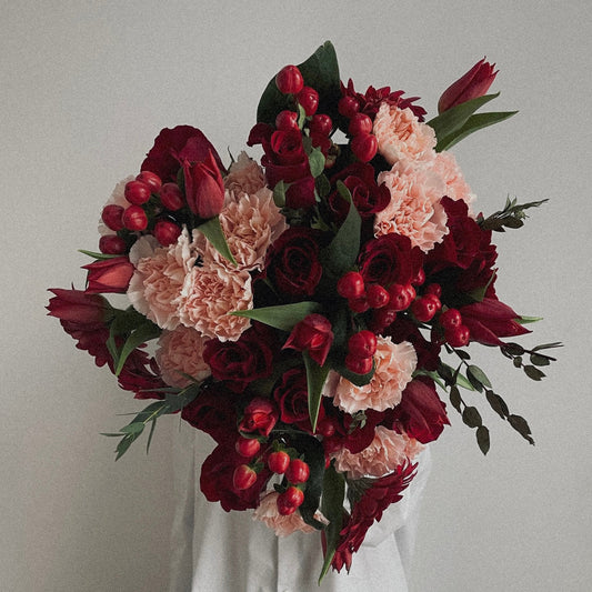 "Passionate red rose bouquet wrapped in luxury paper, the perfect Valentine’s Day or romantic gift."