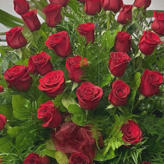 Grand bouquet of premium red roses; luxury sympathy funeral arrangement with same-day delivery in Toronto and GTA.
