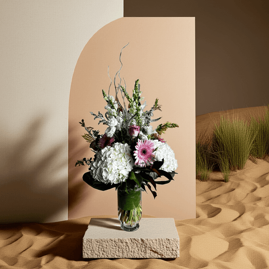 Antoinette’s Classic floral arrangement with white and pink flowers in a vase, showcasing timeless elegance and sophistication.