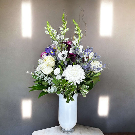 Aster Elegance Bouquet with white roses and purple flowers in a vase, luxury arrangement by best Toronto and GTA florist, fresh and elegant.