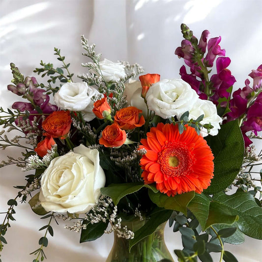 "Luxury floral bouquet with handpicked roses, hydrangeas, and greenery in a glass vase, ideal for weddings, anniversaries, and celebrations
